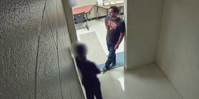 The student was standing in a hallway right before he attempted to leave.