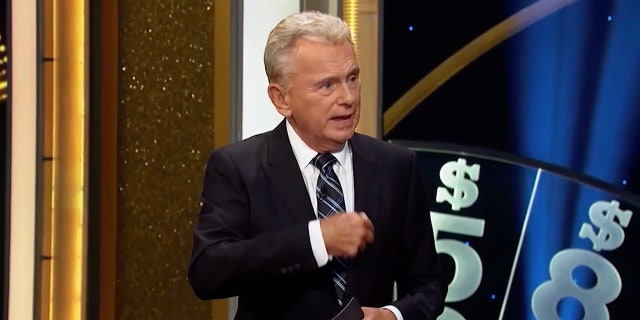 Pat Sajak continues to remind contestants of the rules on the "Wheel of Fortune" game show.