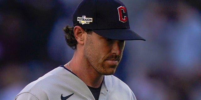 Cleveland Guardians starting pitcher Shane Bieber walks off the field as he is relieved during the seventh inning of Game 2 of an American League Division Series against the New York Yankees Friday, Oct. 14, 2022, in New York.