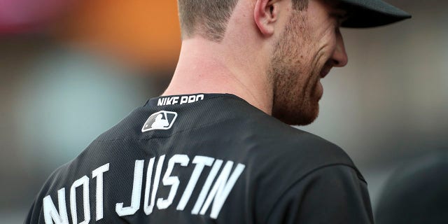 Shane Bieber of the Cleveland Indians sits in the dugout during the first inning against the Kansas City Royals at Progressive Field Aug. 23, 2019.