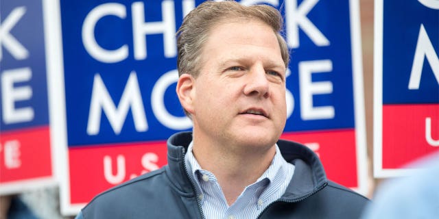 New Hampshire Gov. Chris Sununu appears at a campaign stop for Republican Senate candidate Chuck Morse at the Bedford High School polling location in Bedford, New Hampshire, on Sept. 13, 2022.