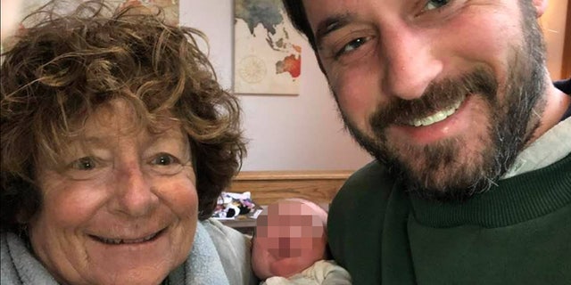 Susan Howe and her son Adam Howe pose with his infant child in 2020. Howe was arrested Friday for her murder — but died Sunday after suffering a medical emergency in his cell, authorities said.
