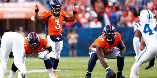 Denver Broncos quarterback Russell Wilson (3) signals to his team during a game against the Indianapolis Colts on October 6, 2022 at Empower Field in Mile High, Denver, Colorado.