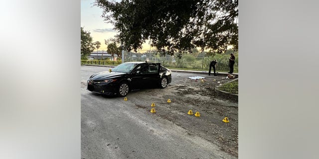 Police say the family of five was sleeping in their car when bullets were fired at them.