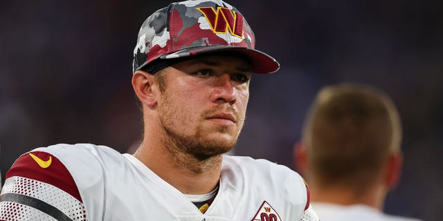 Taylor Heinicke of the Washington Commanders on the sidelines against the Baltimore Ravens during the first half of a preseason game at M and T Bank Stadium Aug. 27, 2022, in Baltimore.