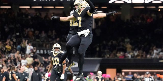 New Orleans Saints' Taysom Hill (7) and Chase Hansen celebrate after Hill recovered a fumble on a Seattle Seahawks fake punt during an NFL football game in New Orleans, Sunday, Oct. 9, 2022.