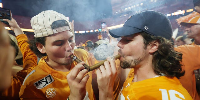 Tennessee fans celebrate on the field after a win against Alabama at Neyland Stadium on Oct. 15, 2022, in Knoxville, Tennessee.