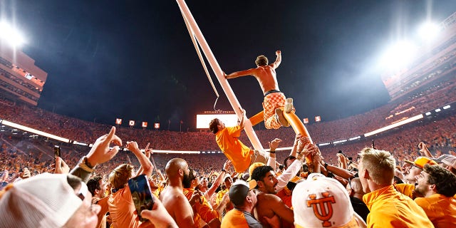 Tennessee fans tear down a goal post after the Vols defeated Alabama 52-49 Saturday, Oct. 15, 2022, in Knoxville, Tenn.