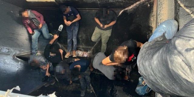 Thirteen illegal immigrants hidden inside a grain hopper rail car. 