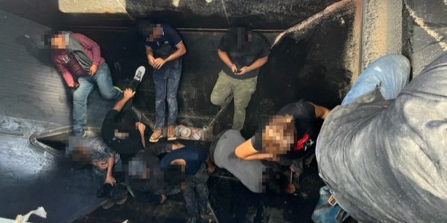 Thirteen illegal immigrants hidden inside a grain hopper rail car.