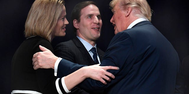 President Donald Trump greets US Army Maj. Scott Smiley (Ret.), who was blinded during the Iraq War, and his wife Tiffany at the National Prayer Breakfast on Feb. 8, 2018 in Washington, DC.