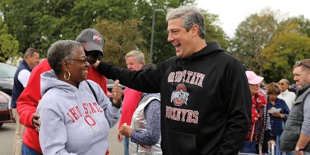 Rep. Tim Ryan, the Democratic Senate nominee in Ohio, speaks with voters at a tailgate party at The Ohio State University football game, on Oct. 1, 2022 in Columbus, Ohio