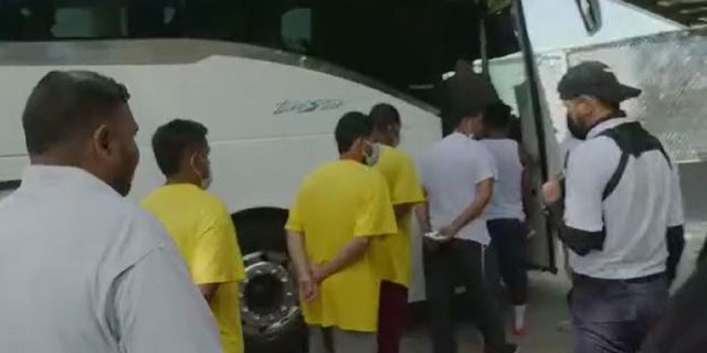 Venezuelans are put on buses after being expelled from the US under Title 42.