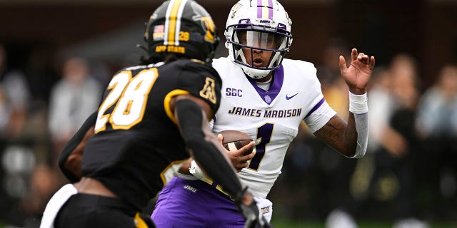 AP Top 25 poll: Shake-up in top spots; James Madison enters rankings for first time 4 Todd Centeio (1) of the James Madison Dukes evades KeSean Brown (28) of the Appalachian State Mountaineers in the first quarter at Kidd Brewer Stadium Sept. 24, 2022, in Boone, N.C.