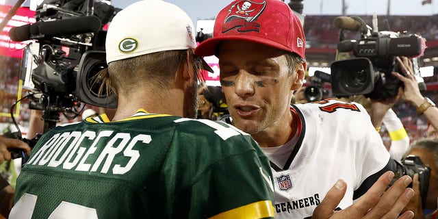 Aaron Rodgers talks with Tom Brady after their game on Sept. 25, 2022, in Tampa, Florida.