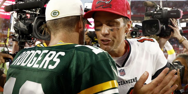 Aaron Rodgers talks with Tom Brady after their game on Sept. 25, 2022, in Tampa, Florida.