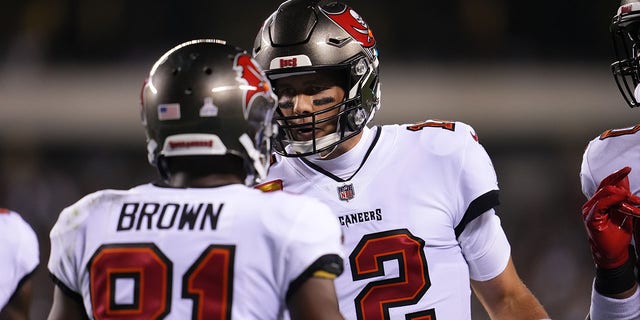 Antonio Brown (81) of the Tampa Bay Buccaneers celebrates with quarterback Tom Brady (12) during an NFL game against the Philadelphia Eagles at Lincoln Financial Field Oct. 14, 2021, in Philadelphia.