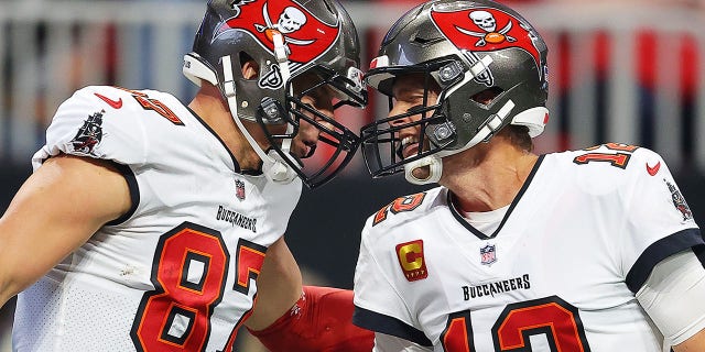 Rob Gronkowski (87) of the Tampa Bay Buccaneers celebrates his touchdown against the Atlanta Falcons with teammate Tom Brady (12) during the second quarter at Mercedes-Benz Stadium Dec. 5, 2021, in Atlanta.