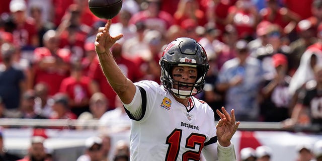 Buccaneers quarterback Tom Brady throws a touchdown pass to running back Leonard Fournette against the Atlanta Falcons on Sunday, Oct. 9, 2022, in Tampa, Florida.