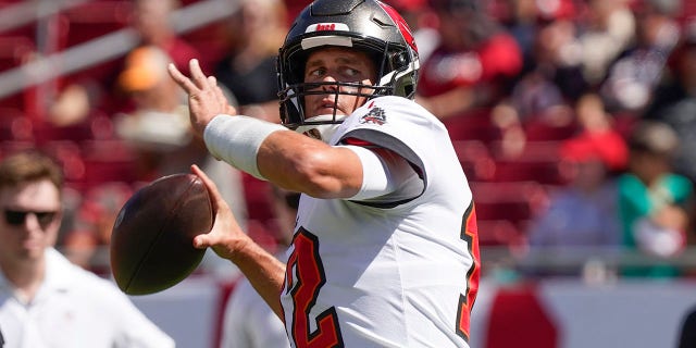 Tampa Bay Buccaneers quarterback Tom Brady (12) warms up before the first half of a game against the Atlanta Falcons Sunday, Oct. 9, 2022, in Tampa, Fla.