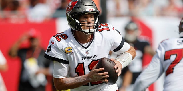 Tampa Bay Buccaneers Quarterback Tom Brady (12) looks for an open receiver during the regular season game between the Atlanta Falcons and the Tampa Bay Buccaneers on Oct. 9, 2022 at Raymond James Stadium in Tampa, Florida.