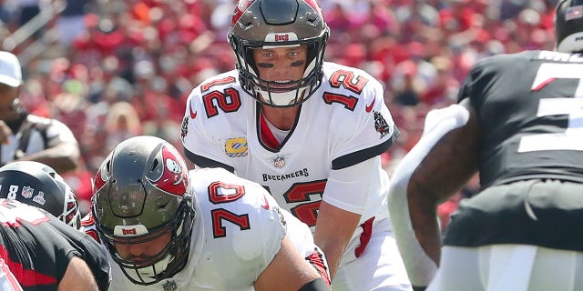 Tampa Bay Buccaneers quarterback Tom Brady (12) looks over the Atlanta Falcons' defense during a game Oct. 9, 2022, at Raymond James Stadium in Tampa, Fla.