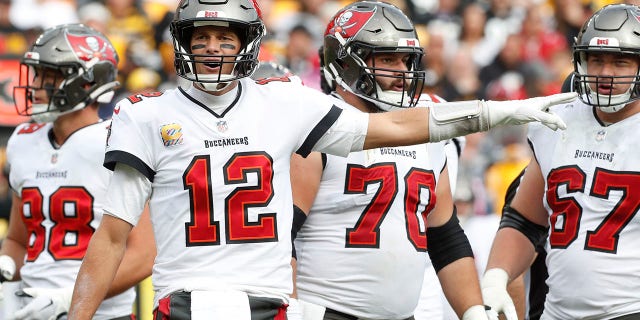 Tampa Bay Buccaneers quarterback Tom Brady signals a penalty against the Steelers on Oct. 16, 2022 at Acrichure Stadium in Pittsburgh.