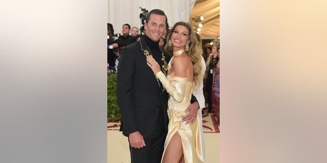 Tom Brady and Gisele Bundchen wears matching gold outfits to Met Gala in New York City in 2018