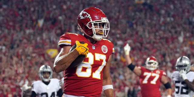 Travis Kelce #87 of the Kansas City Chiefs catches a pass in the endzone for a touchdown during the 1st half of the game against the Las Vegas Raiders at Arrowhead Stadium on October 10, 2022 in Kansas City, Missouri.