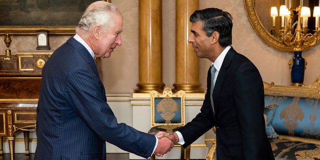 King Charles III welcomes Rishi Sunak during an audience at Buckingham Palace, London, where he invited the newly elected leader of the Conservative Party to become prime minister and form a new government, Tuesday, Oct. 25, 2022.