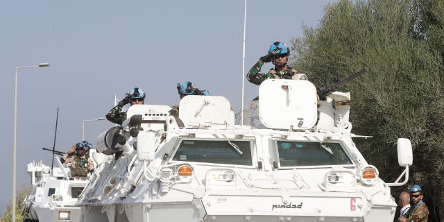 United Nations peacekeeping force in Lebanon (UNIFIL) vehicles drive along the main road leading to Lebanon's southern town of Naqura close to the border with Israel on October 27, 2022.