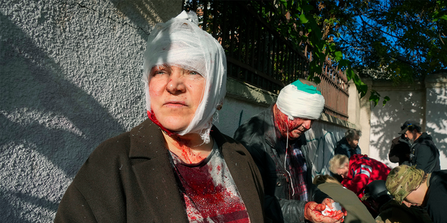 People receive medical treatment at the scene of the Russian bombing in Kiev, Ukraine on Monday, October 10, 2022.