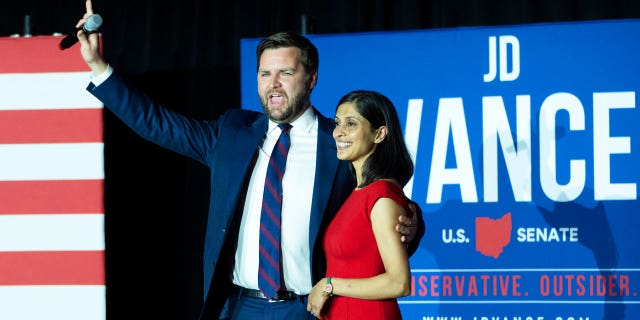 JD Vance and his wife Usha Vance wave to supporters after winning the primary, at an election night event at Duke Energy Convention Center on May 3, 2022, in Cincinnati, Ohio.