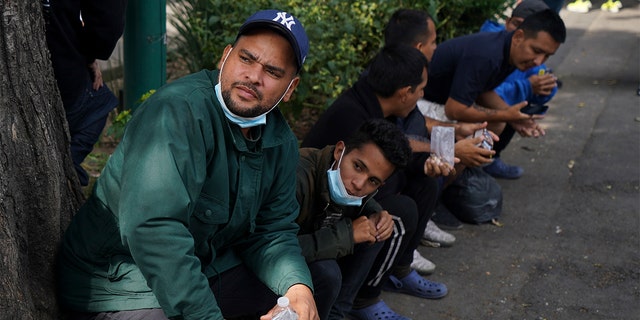 Venezuelan migrants wait for assistance outside the Mexican Commission for Refugee Aid in Mexico City, Thursday, Oct. 20, 2022. This group of migrants interrupted their trek in Mexico City after the U.S. announced that Venezuelans who walk or swim across the border will be immediately returned to Mexico without the right to seek asylum. 