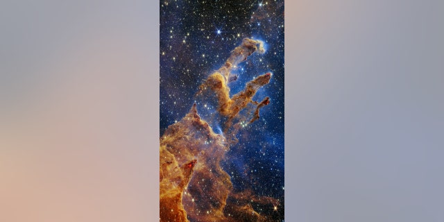 The Pillars of Creation are set off in a kaleidoscope of color in NASA’s James Webb Space Telescope’s near-infrared-light view. The pillars look like arches and spires rising out of a desert landscape, but are filled with semi-transparent gas and dust, and ever-changing. This is a region where young stars are forming – or have barely burst from their dusty cocoons as they continue to form.