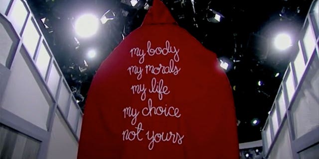 Whoopi Goldberg dresses up in red cloak from