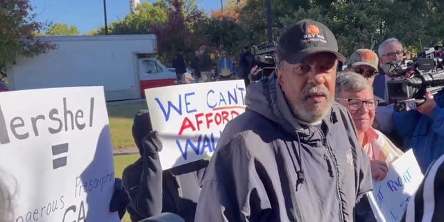 A small group of protesters crashed a press conference being held by Republican Georgia Senate candidate Herschel Walker on October 18 2022, with one reportedly calling him a 'house n-----."