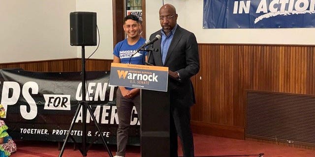 Democratic Georgia Sen.  Raphael Warnock speaks to supporters at an Atlanta-area Methodist Church during a Hispanic Heritage Month celebration on October 12, 2022.