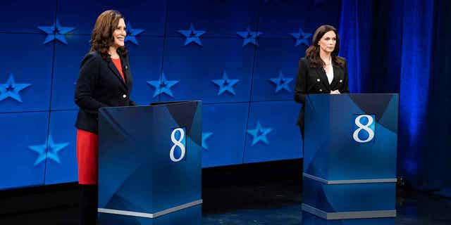 Democratic Gov. Gretchen Whitmer, left, and Republican gubernatorial candidate Tudor Dixon are seen during a Michigan Governor debate, Thursday, Oct. 13, 2022, at WOOD-TV in Grand Rapid, Mich. (Bryan Esler/Nexstar Media Group/WOOD-TV via AP)