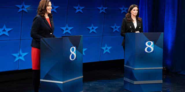 Democratic Gov. Gretchen Whitmer, left, and Republican gubernatorial candidate Tudor Dixon are seen during a Michigan Governor debate, Thursday, Oct. 13, 2022, at WOOD-TV in Grand Rapid, Mich. (Bryan Esler/Nexstar Media Group/WOOD-TV via AP)