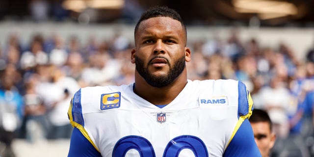 Aaron Donald of the Los Angeles Rams during the national anthem before a game against the Dallas Cowboys at SoFi Stadium in Inglewood, California on October 9, 2022.