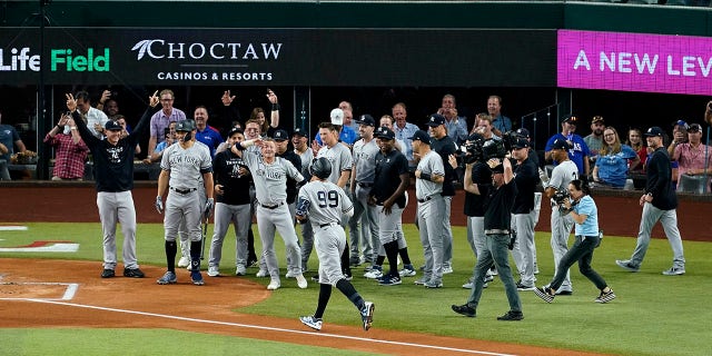 Aaron Judge of the New York Yankees hits his 62nd home run of the season in Game 2 of a doubleheader against the Texas Rangers on Oct. 4, 2022 in Arlington, Texas.