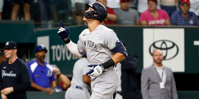 Aaron Judge of the New York Yankees reacts after hitting his 62nd home run of the season against the Texas Rangers during the first inning in game two of a doubleheader at Globe Life Field Oct. 4, 2022, in Arlington, Texas. 