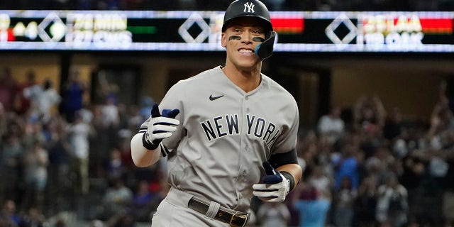 Aaron Judge of the New York Yankees hits his 62nd home run of the season in Game 2 of a doubleheader against the Texas Rangers on Oct. 4, 2022 in Arlington, Texas.