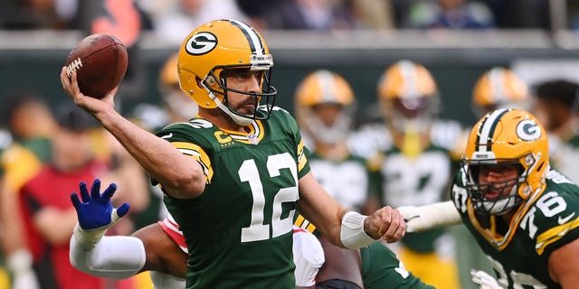 Aaron Rodgers (12) of the Green Bay Packers looks to pass in the second half during a game against the New York Giants at Tottenham Hotspur Stadium Oct. 9, 2022, in London.