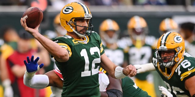 Aaron Rodgers (12) of the Green Bay Packers looks to pass in the second half during a game against the New York Giants at Tottenham Hotspur Stadium Oct. 9, 2022, in London.