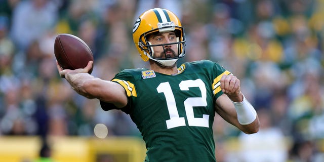 Aaron Rodgers of the Green Bay Packers attempts a pass during the third quarter against the New England Patriots at Lambeau Field on Oct. 2, 2022, in Green Bay, Wisconsin.