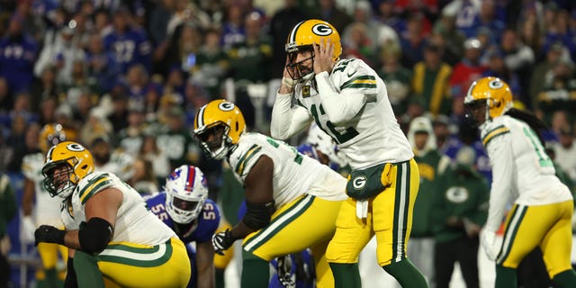 Aaron Rodgers #12 of the Green Bay Packers prepares to take a snap during the third quarter against the Buffalo Bills at Highmark Stadium on October 30, 2022, in Orchard Park, New York.