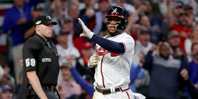 Ronald Acuna Jr. #13 of the Atlanta Braves scores a run against the Philadelphia Phillies during the sixth inning in game two of the National League Division Series at Truist Park on October 12, 2022, in Atlanta, Georgia.