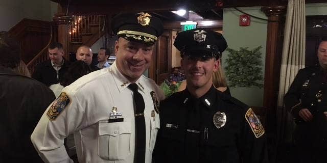 Officer Alec Iurato, right, with Bristol Police Chief Brian Gould, left. (Bristol Police Department.)